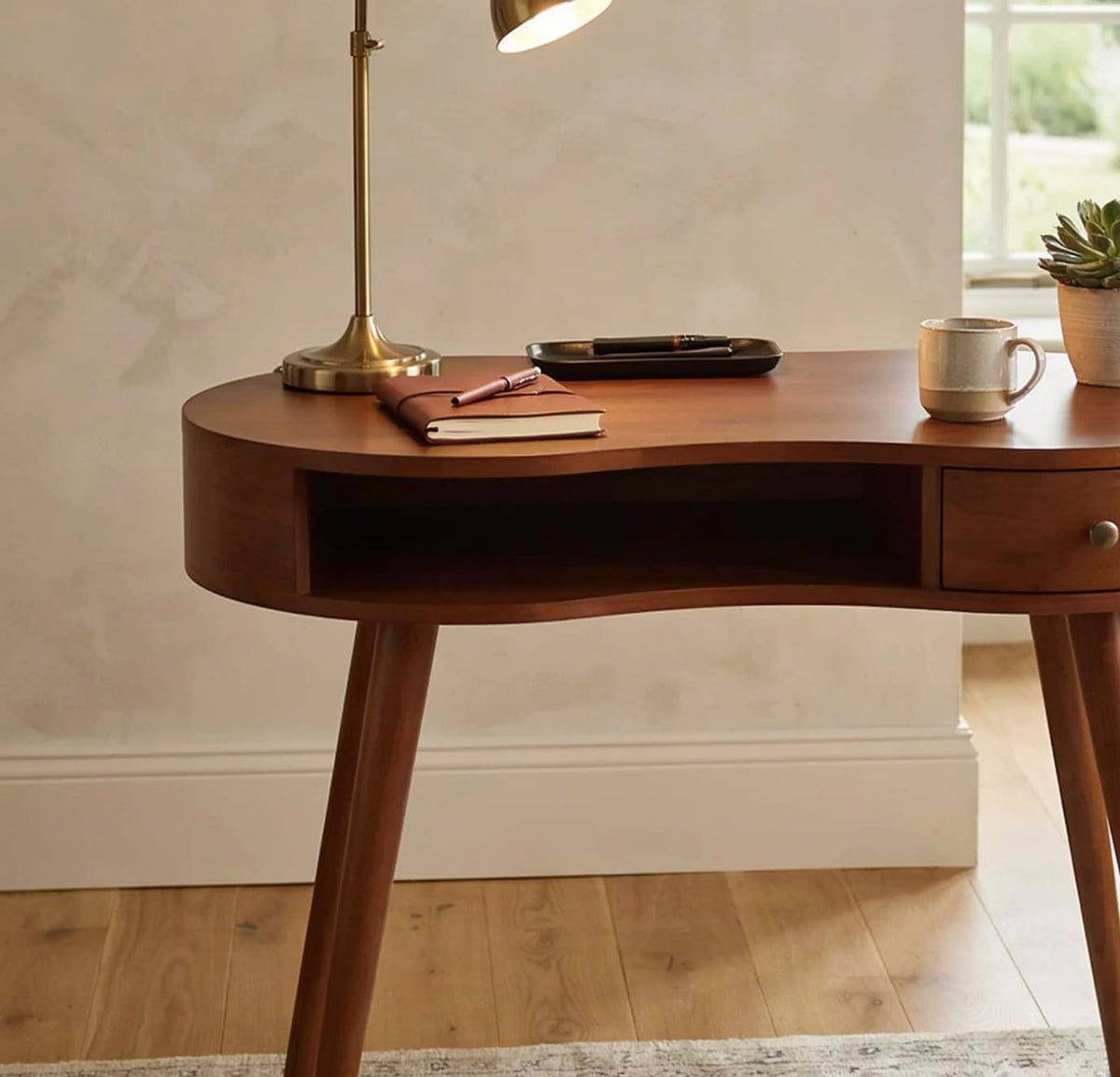 Organic modern solid wood desk featuring graceful curved lines and live edge inspiration