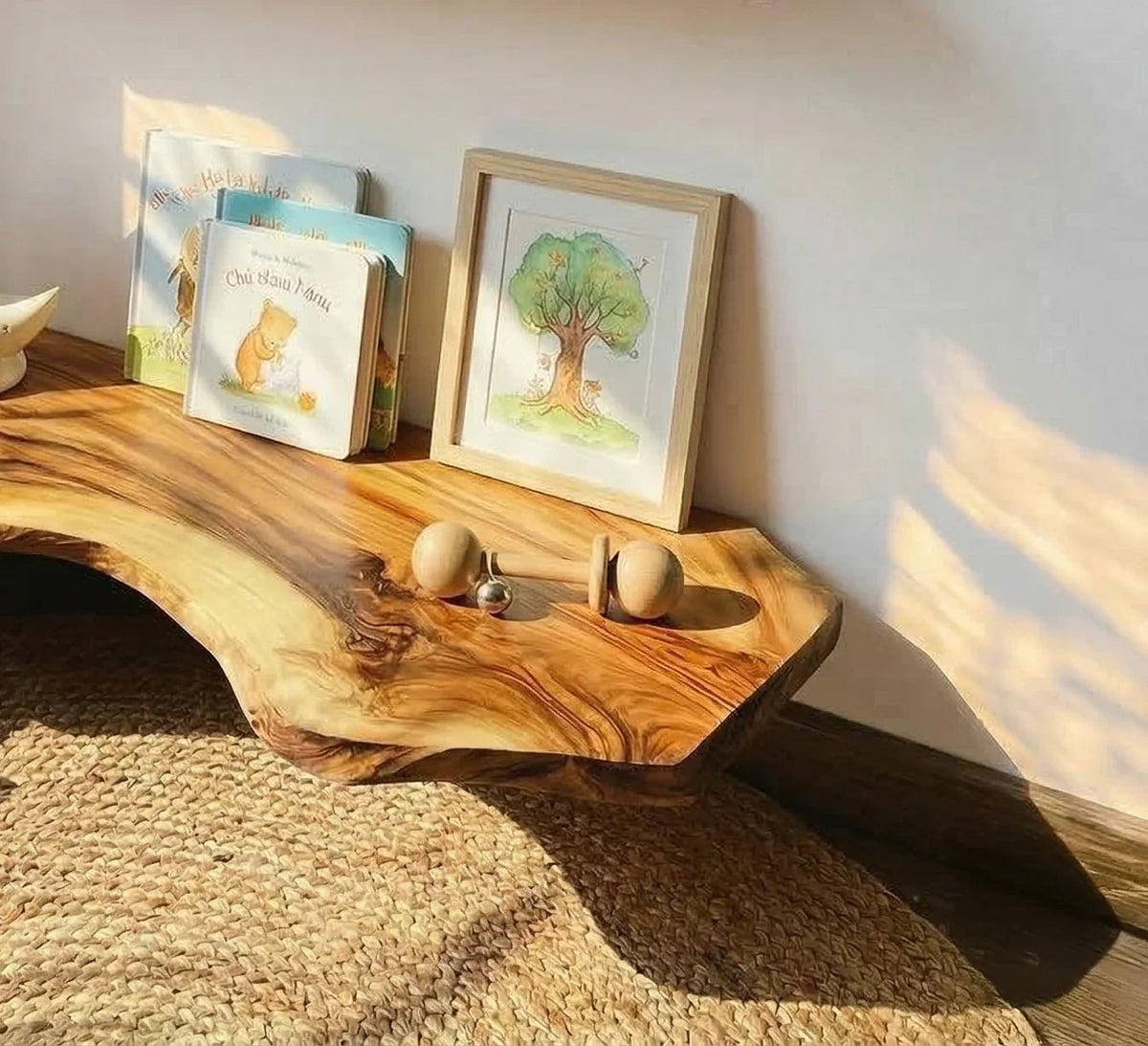 handcrafted live edge floating shelves in kids room with books, toys, and natural wood decor