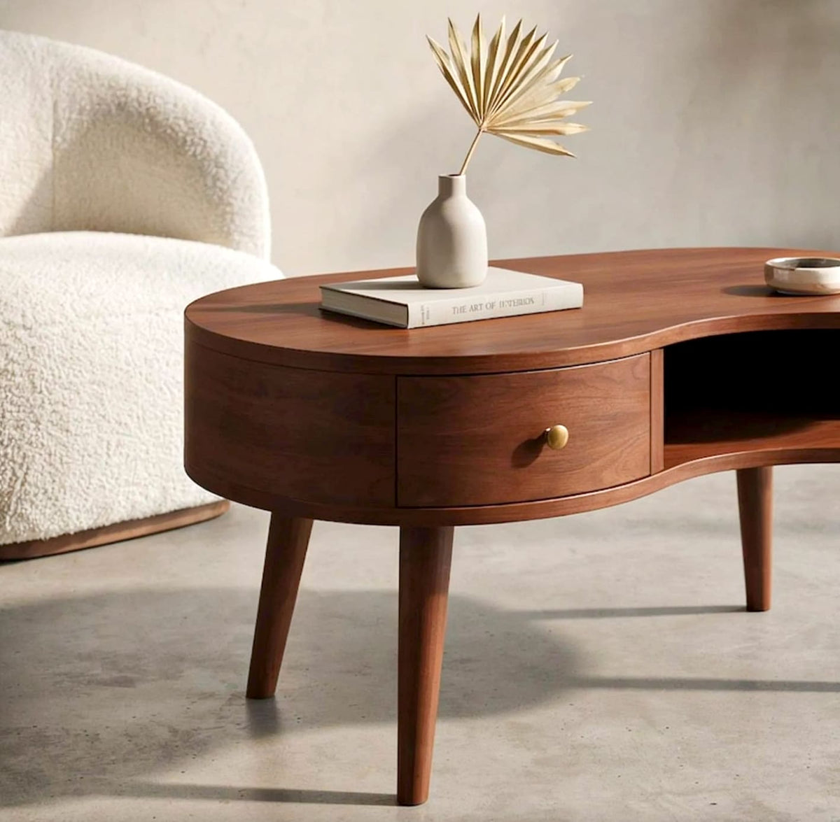 Modern curved solid wood coffee table featuring functional drawer storage
