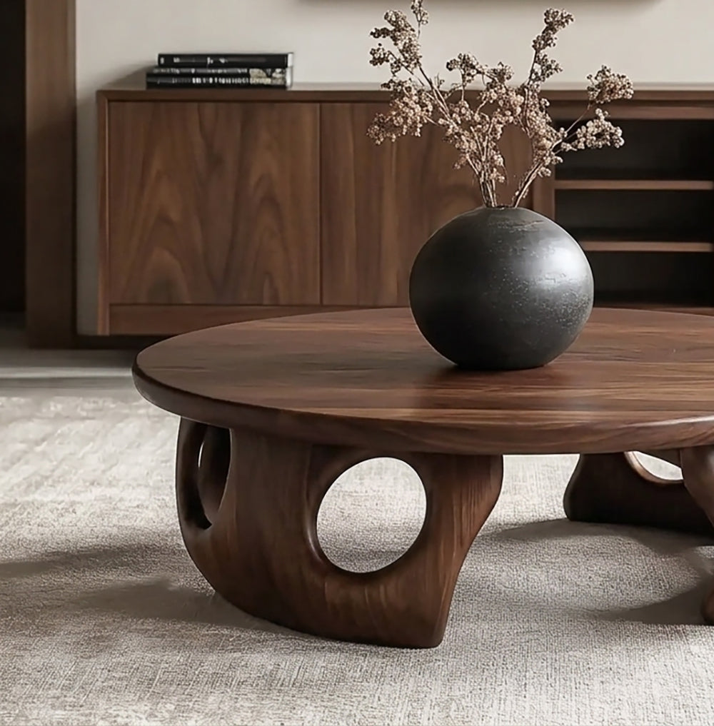 Organic modern coffee table featuring a handcrafted round design and natural wood grain