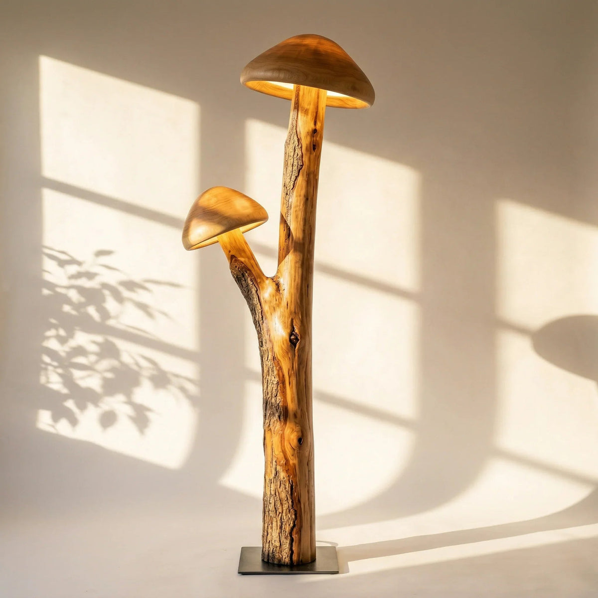 Dual mushroom floor lamp with translucent caps on a natural wood trunk and metal base