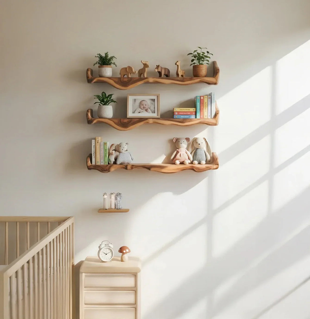 natural wood floating shelves in nursery with baby books, toys, and soft decor items