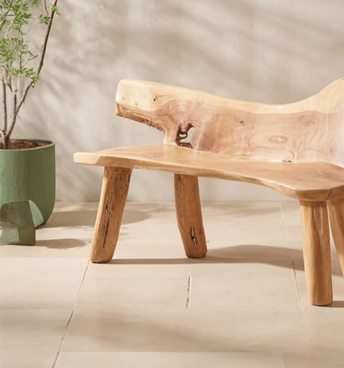 Organic live edge solid wood garden bench featuring exposed joinery details