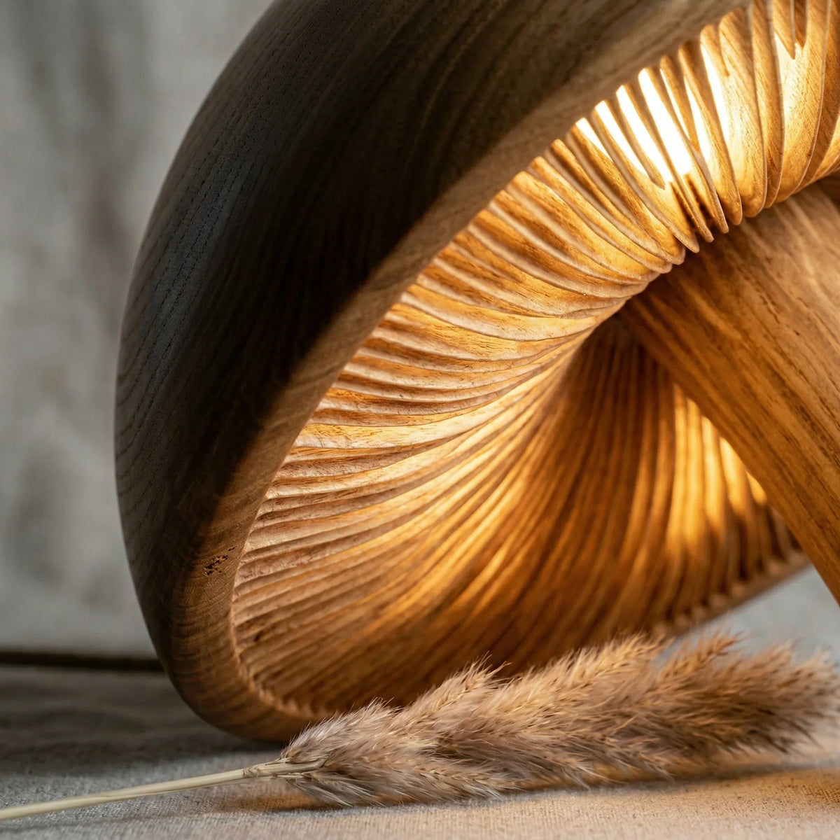 Hand-carved wooden mushroom floor lamp with illuminated gills and natural driftwood stem