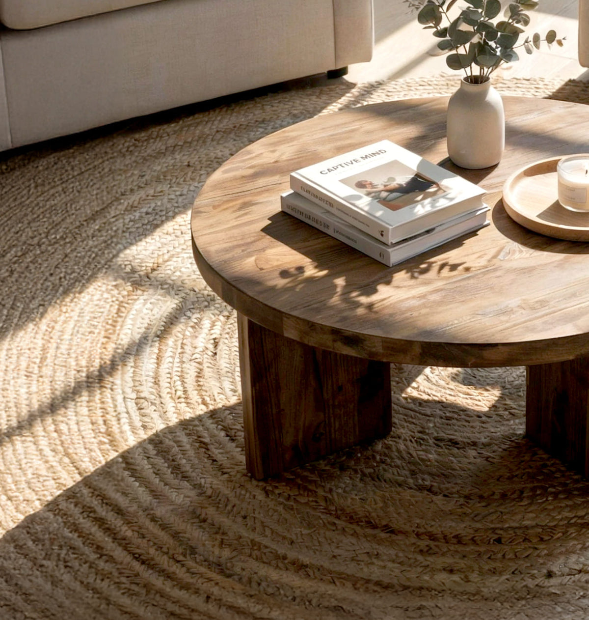 Organic modern round coffee table featuring handcrafted solid wood construction